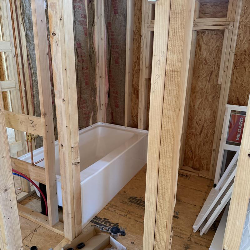 Bathtub rough-in plumbing with surrounding wall studs Bathtub rough-in plumbing with surrounding wall studs