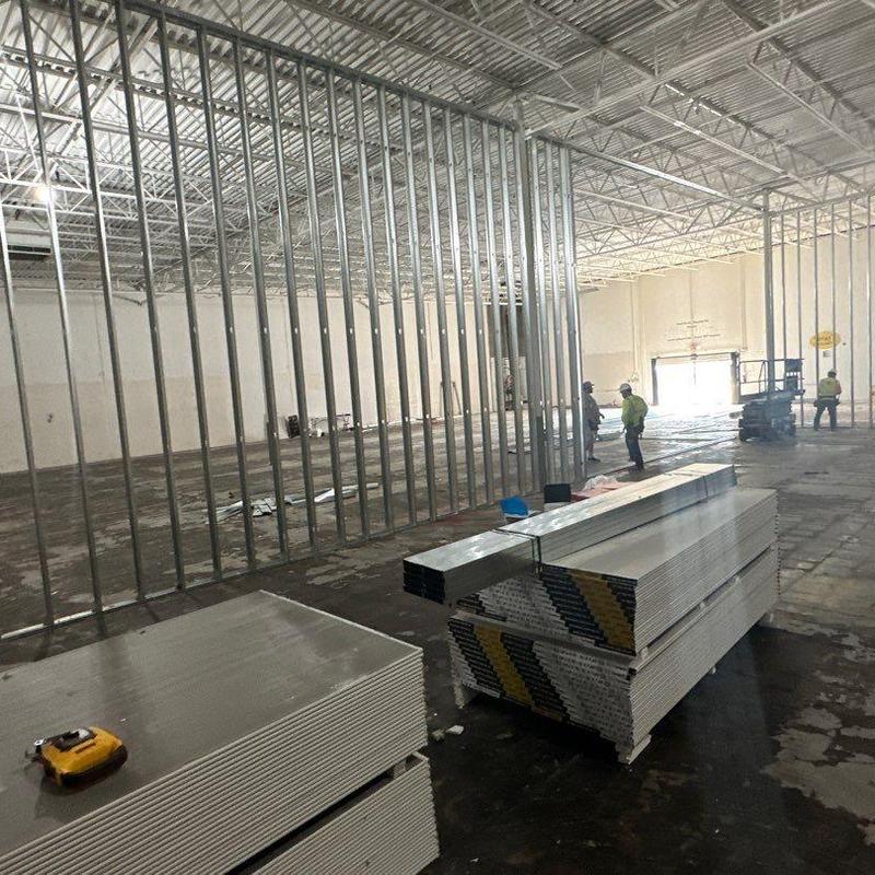 Metal stud framing installation in commercial warehouse Metal stud framing installation in commercial warehouse