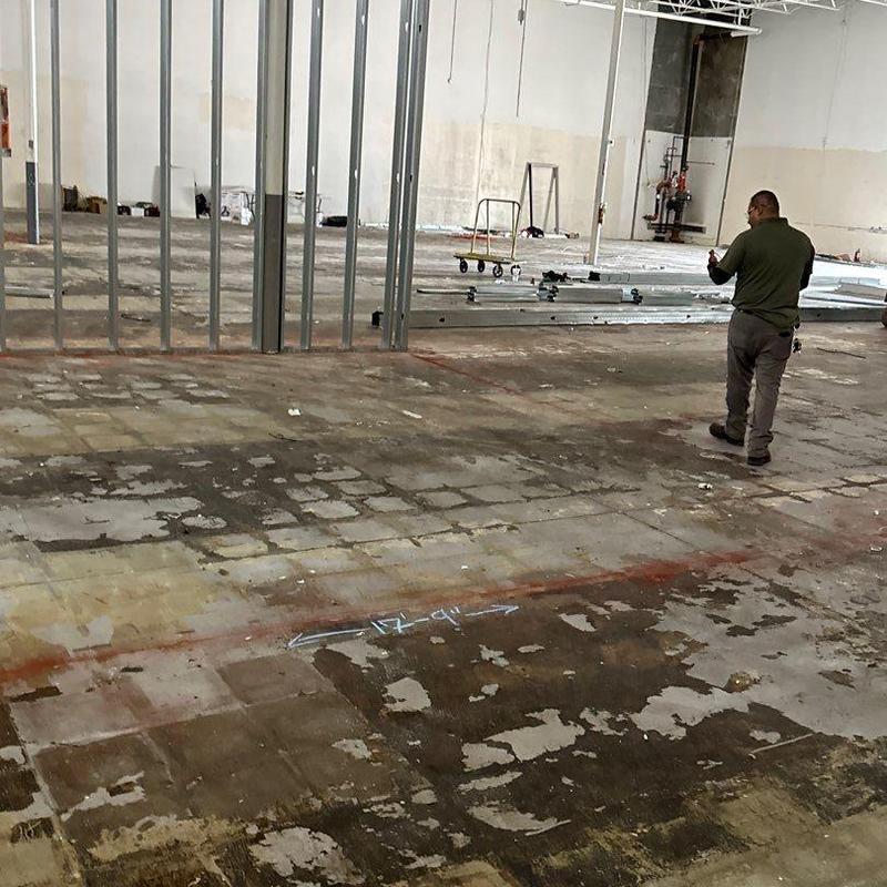 Concrete floor prep at warehouse construction site Concrete floor prep at warehouse construction site