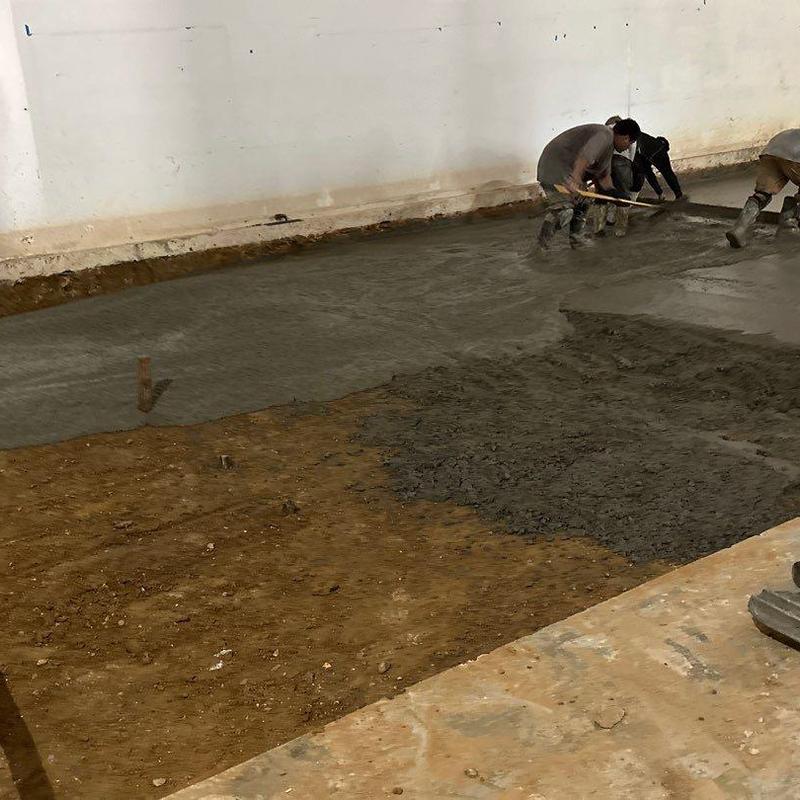 Concrete floor pouring and finishing in warehouse space Concrete floor pouring and finishing in warehouse space