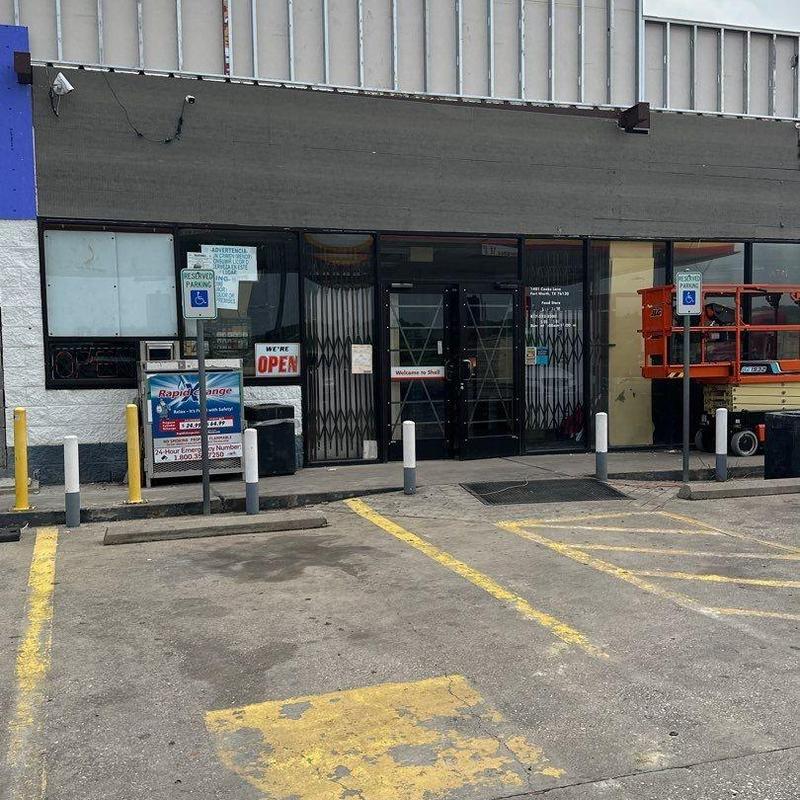 Concrete block exterior wall with storefront and window openings Concrete block exterior wall with storefront and window openings