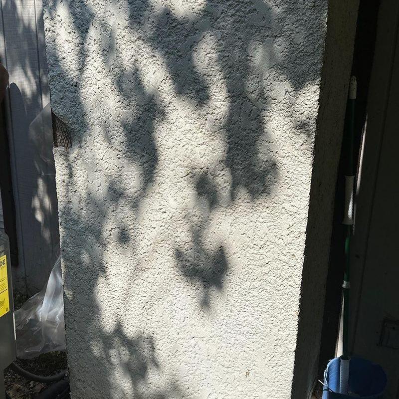 Damaged stucco wall with exposed framing and lath Damaged stucco wall with exposed framing and lath