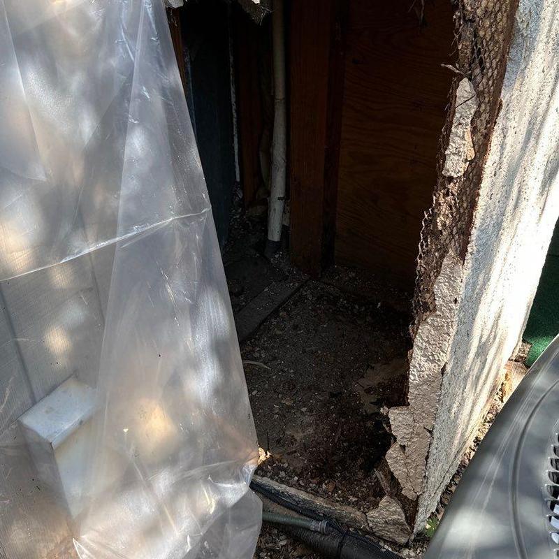 Stucco exterior with damaged framing and lath exposed Stucco exterior with damaged framing and lath exposed