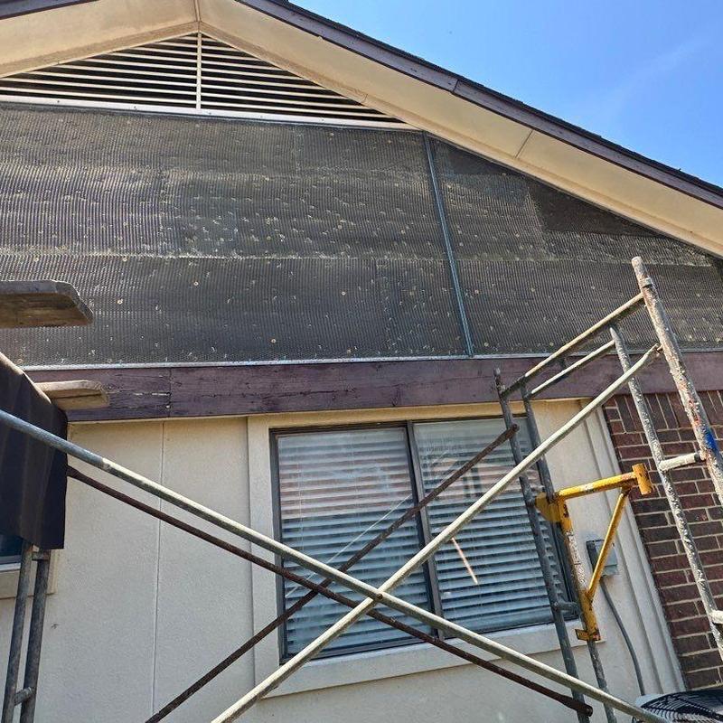 Upper gable stucco lath installation with scaffolding Upper gable stucco lath installation with scaffolding