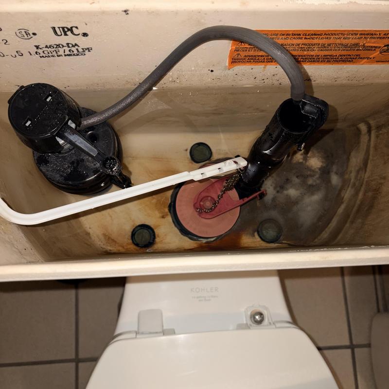 Toilet tank components inside plumbing repair Toilet tank components inside plumbing repair