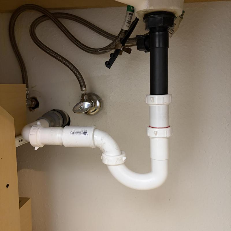 Sink drain pipes and flexible water supply lines under sink Sink drain pipes and flexible water supply lines under sink