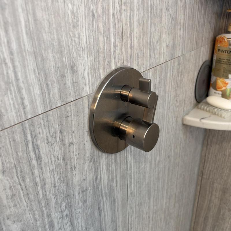 Shower valve and handle on tiled wall