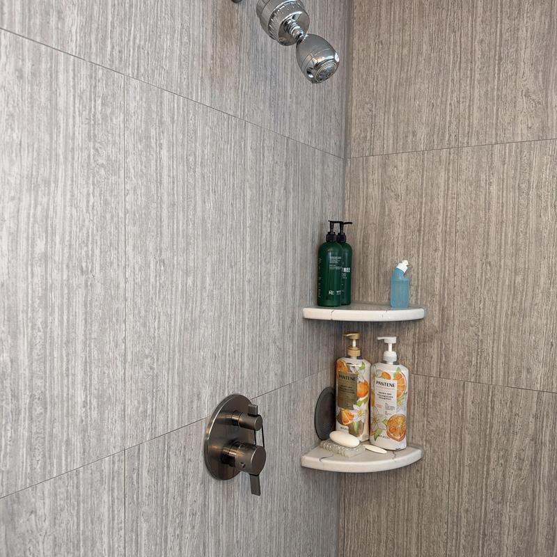 Shower valve and dual corner shelves with toiletries