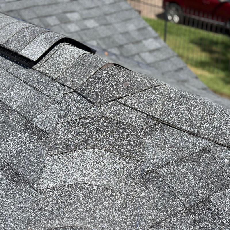 Tamko Titan XT asphalt shingles on roof ridge Tamko Titan XT asphalt shingles on roof ridge