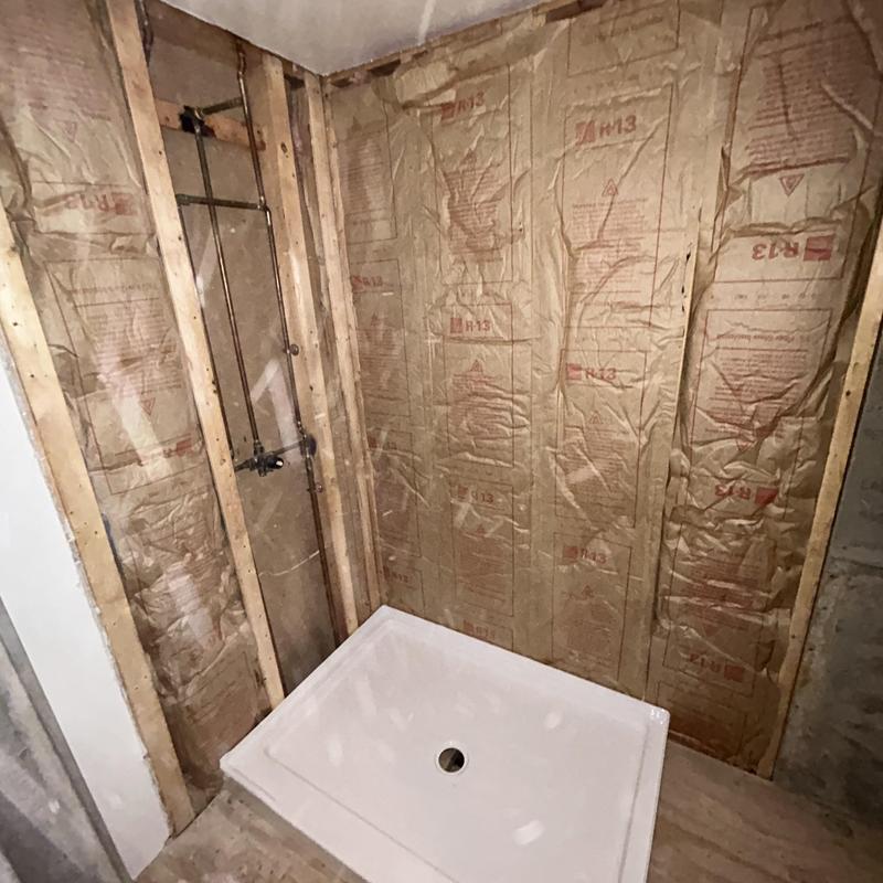 Shower base and valve trim installed with insulation Shower base and valve trim installed with insulation