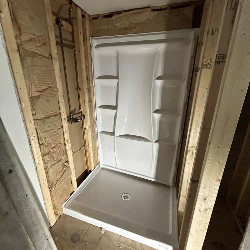 Shower base and surround installation with valve trim Shower base and surround installation with valve trim