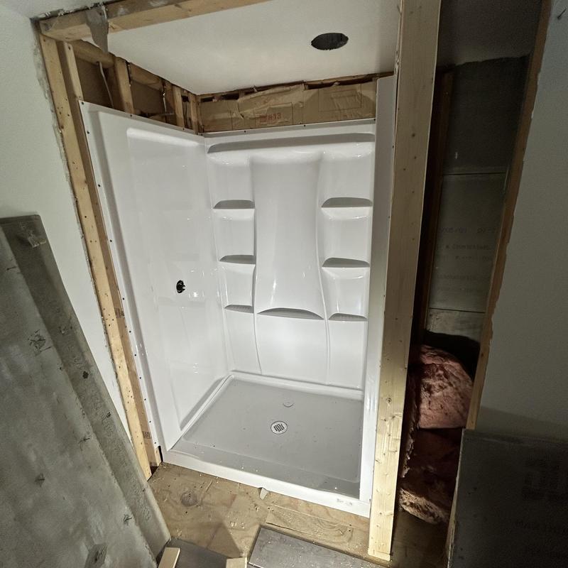 Shower base and surround installation in framed wall Shower base and surround installation in framed wall