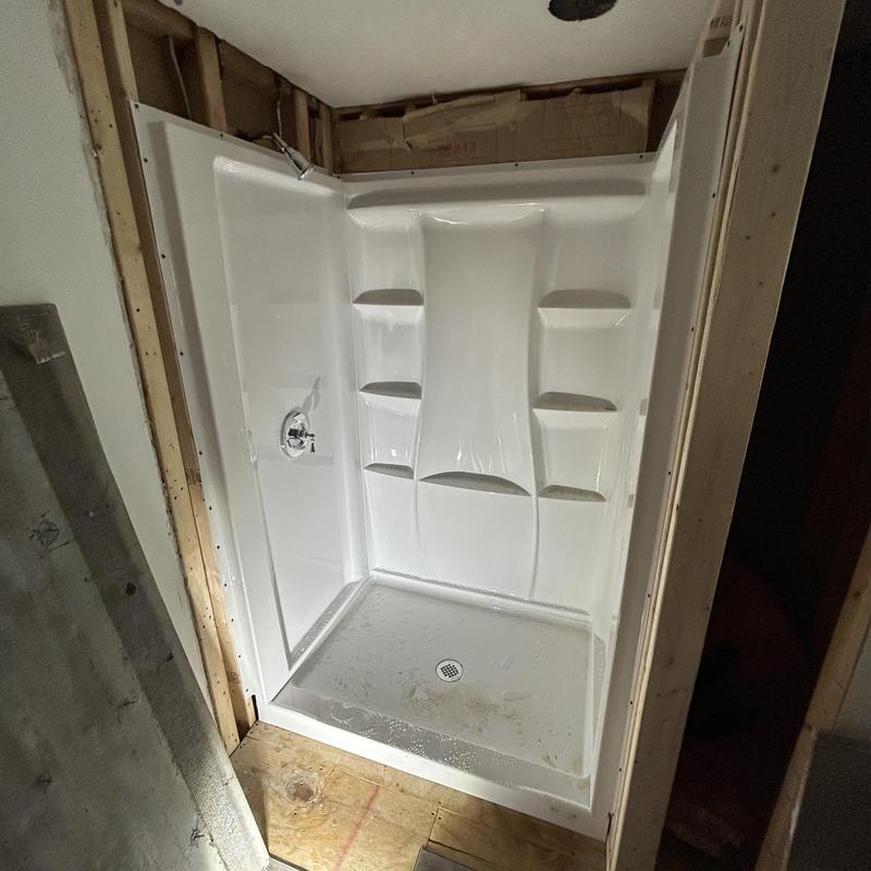 Shower base and surround installation with valve trim Shower base and surround installation with valve trim