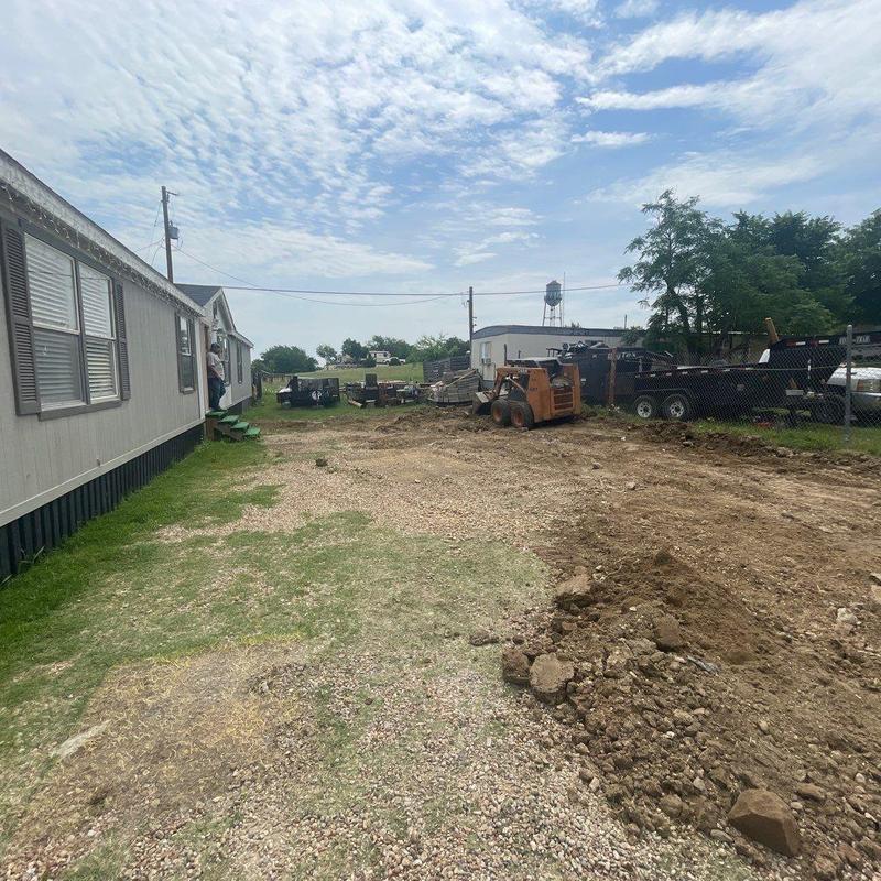 Concrete driveway site preparation with heavy equipment Concrete driveway site preparation with heavy equipment
