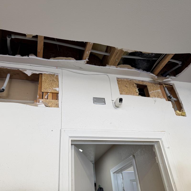 Hot water line rerouted through garage ceiling