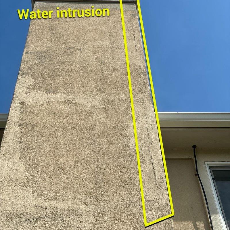 Stucco chimney crack with water intrusion sign Stucco chimney crack with water intrusion sign