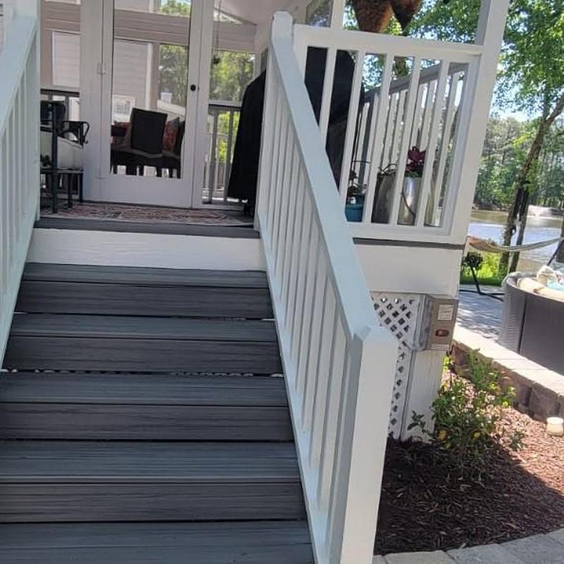 Composite deck stairs with white railing in Cary NC
