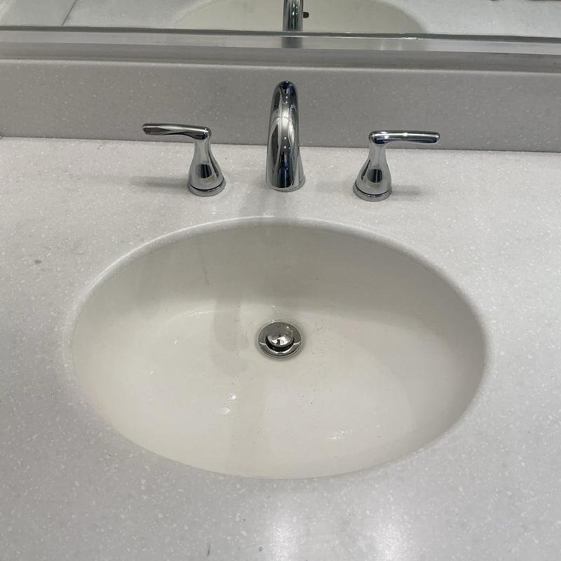 Bathroom sink faucet with chrome handles installed