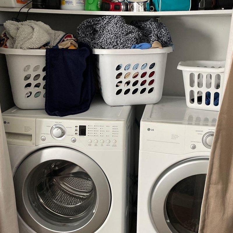 Front-load washer and dryer with laundry baskets Front-load washer and dryer with laundry baskets
