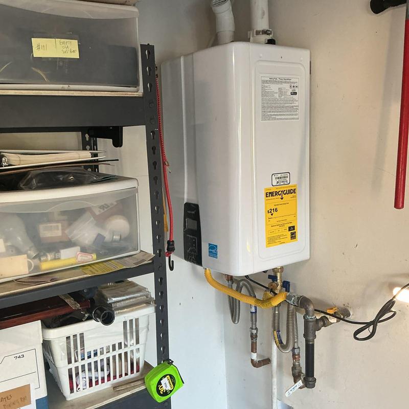 Navien tankless water heater with plumbing connections