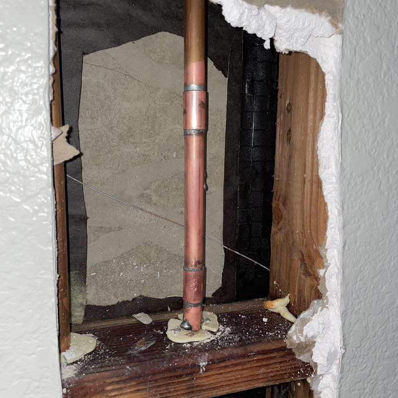 12-inch copper piping with soldered joints inside wall cavity