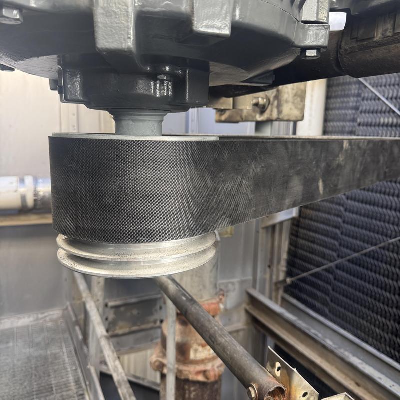 Cooling tower motor pulley and belt assembly close-up Cooling tower motor pulley and belt assembly close-up