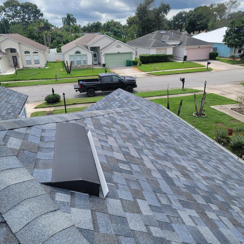 Roof vent installation on shingled residential roof Roof vent installation on shingled residential roof