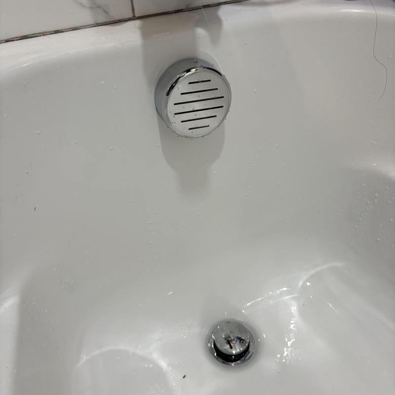 Tub overflow drain with PVC waste repair in bathroom