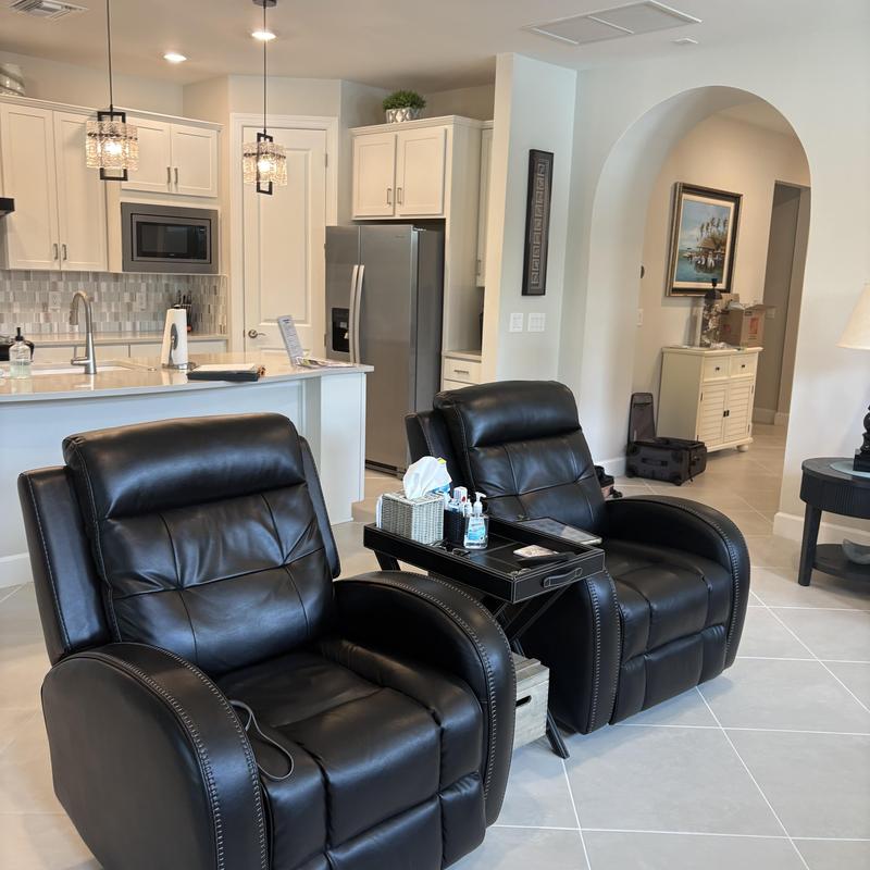 Leather recliner chairs with side table in living room