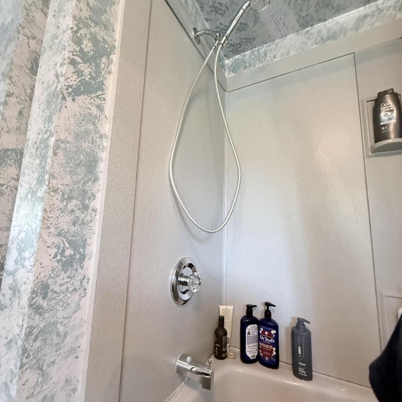 Shower trim with tub drain and wall niche storage