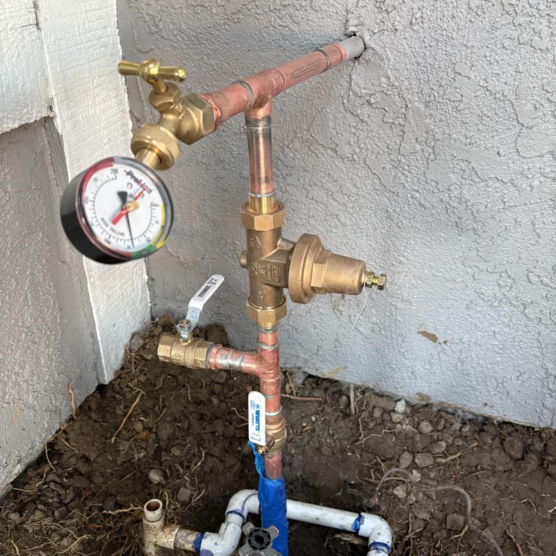 Copper main riser with pressure gauge and shutoff valves