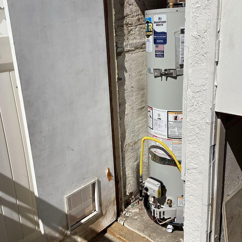 40-gallon water heater with gas and water lines installed