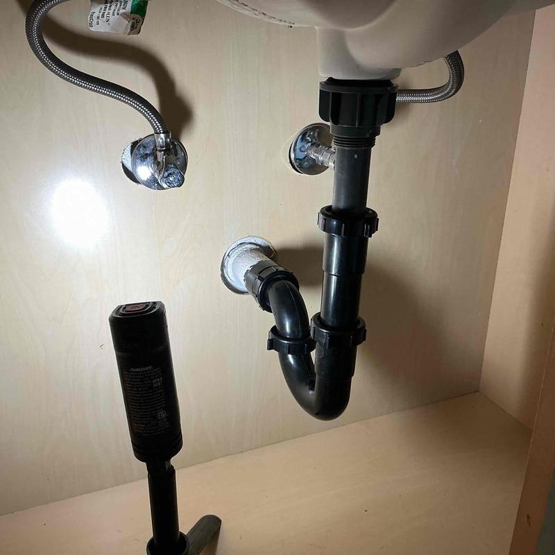 Tubular drainage piping under sink with new ABS connections