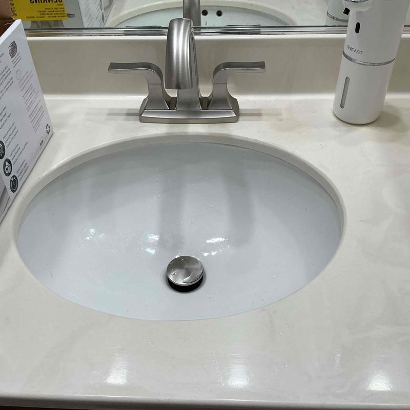 Center set bathroom faucet with sink and countertop