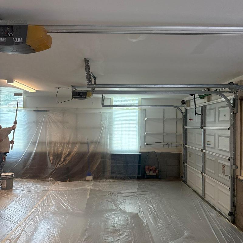 Garage ceiling with fresh paint and plastic sheeting