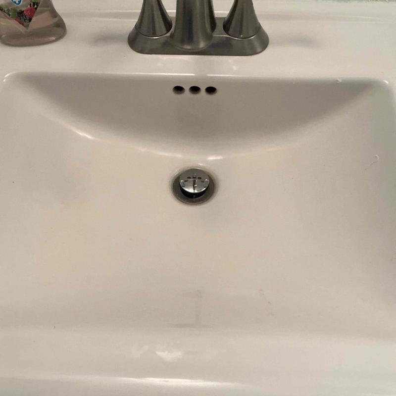 Pop-up drain assembly in bathroom sink installation