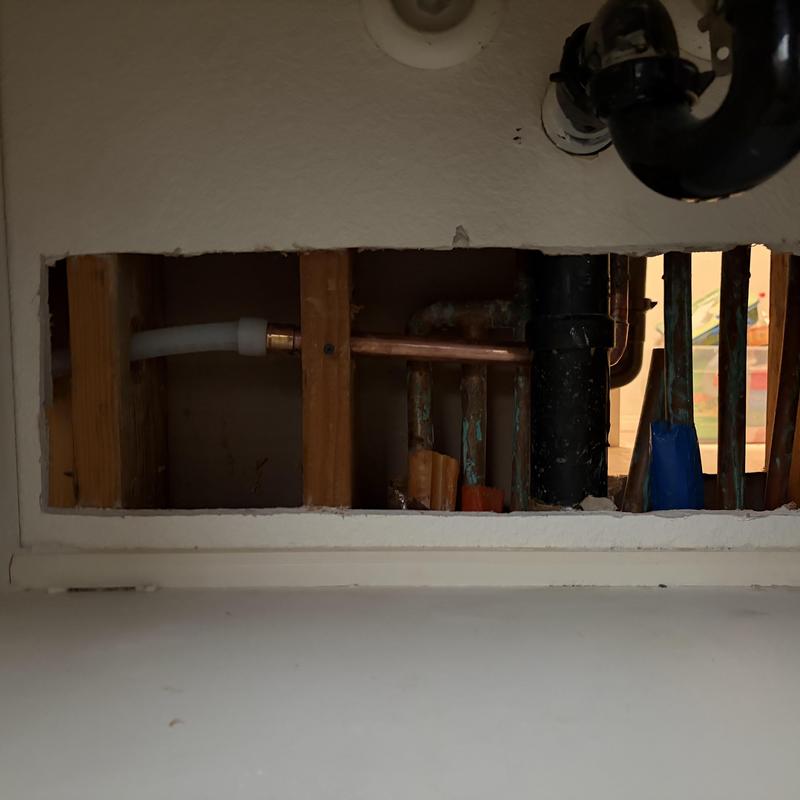 Copper waterline reroute inside wall studs with plumbing pipes