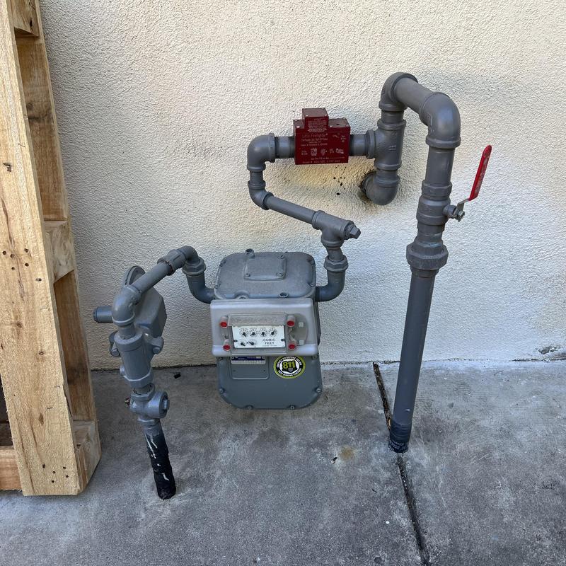 Gas meter with earthquake valve and gray painted piping Gas meter with earthquake valve and gray painted piping