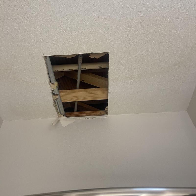 Plumbing pipes in ceiling access hole Plumbing pipes in ceiling access hole