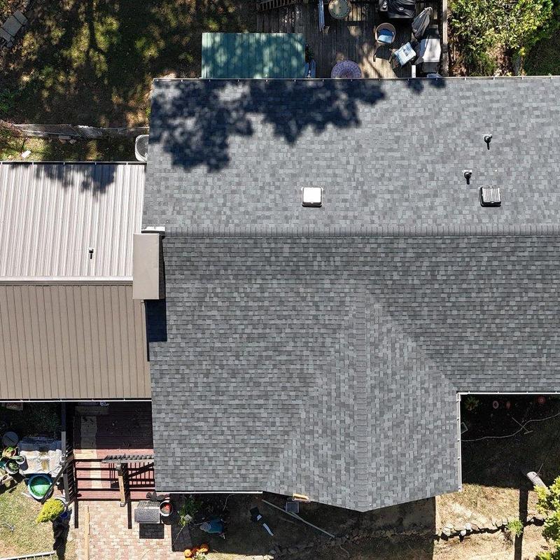 Asphalt shingle roof with vents and chimney caps Asphalt shingle roof with vents and chimney caps