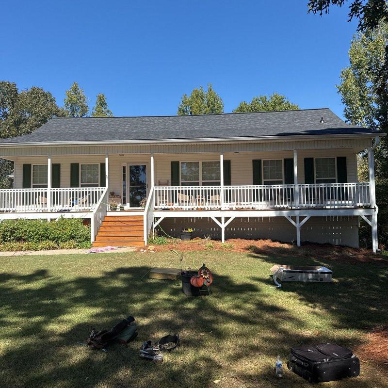 Asphalt shingle roof replacement on ranch home porch Asphalt shingle roof replacement on ranch home porch