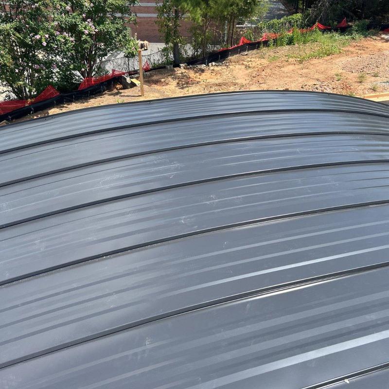 Curved standing seam metal barrel roof panels Curved standing seam metal barrel roof panels