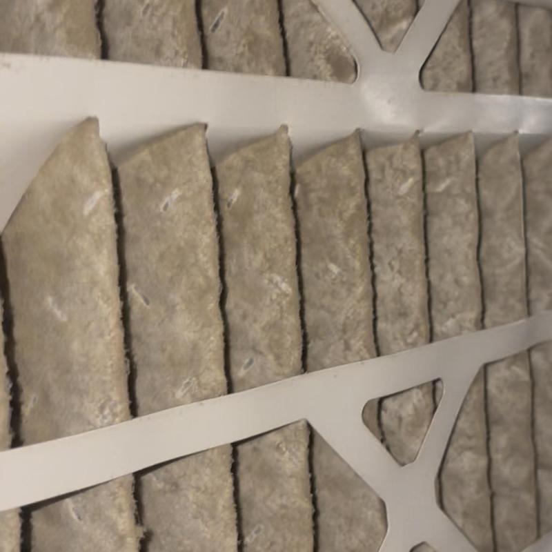 HVAC air filter with heavy dirt buildup close-up HVAC air filter with heavy dirt buildup close-up