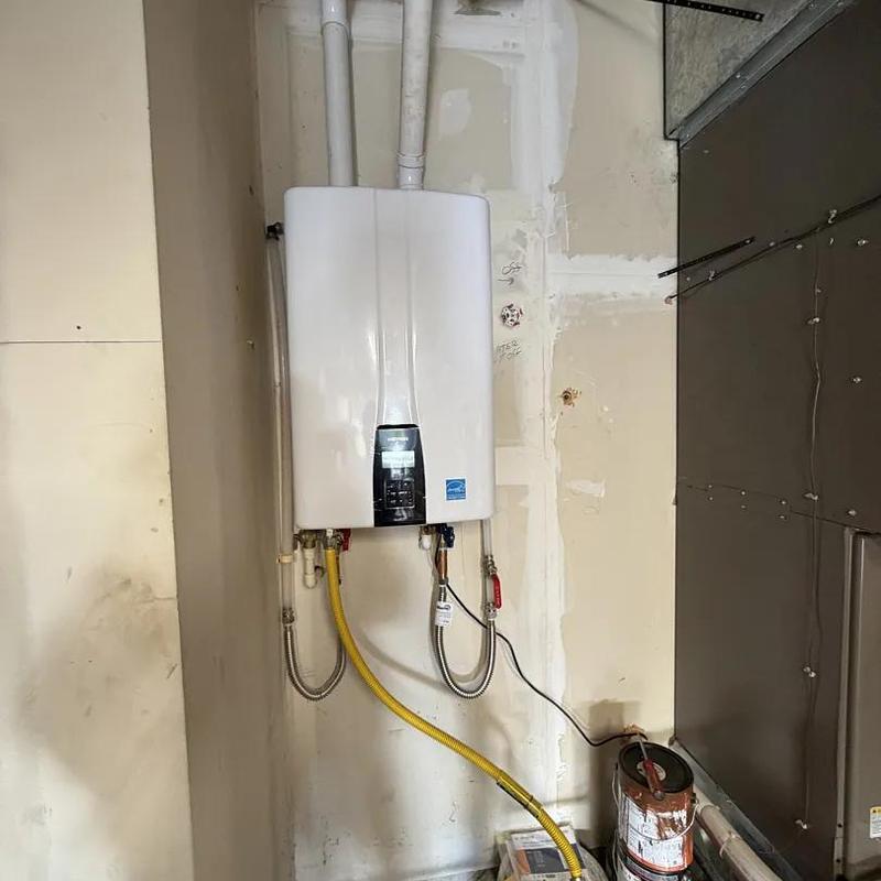 Tankless water heater installation with vent piping Tankless water heater installation with vent piping