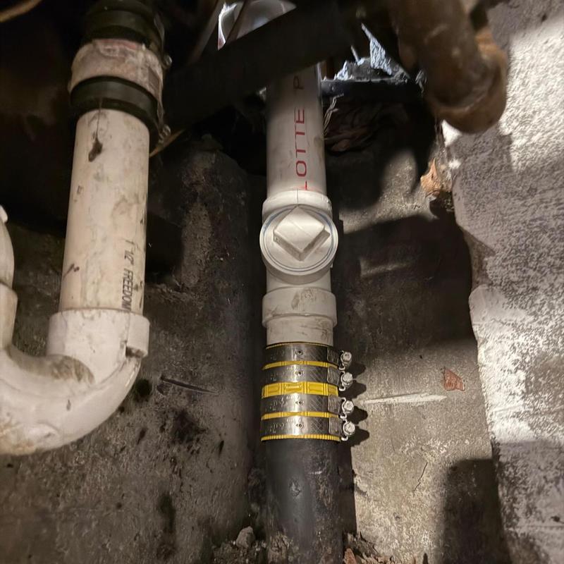 PVC sink drain pipe and cast iron pipe connection with clamps