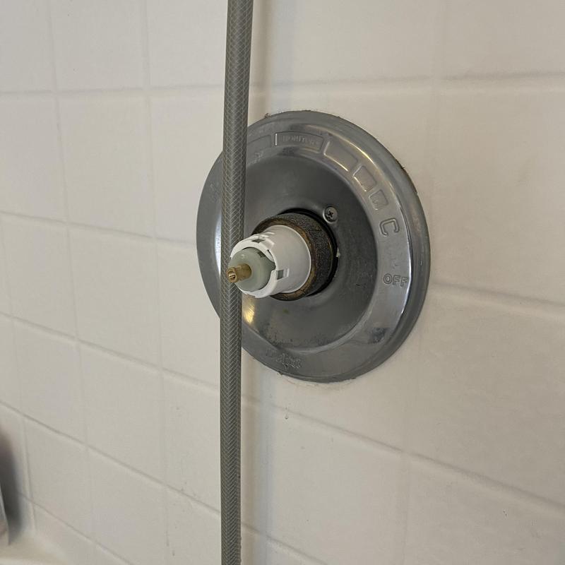 Delta shower cartridge installed in valve housing