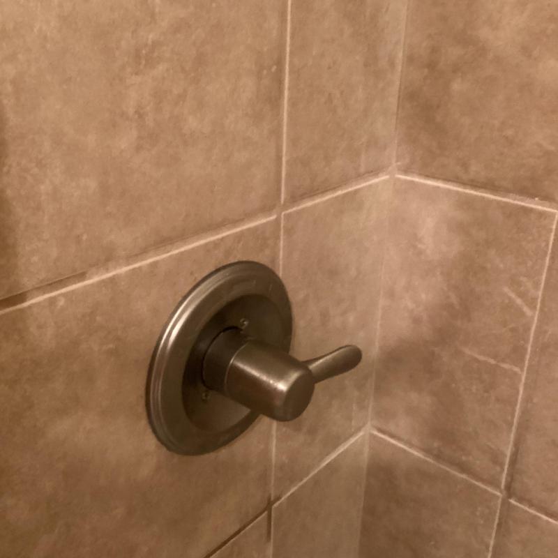 Delta shower valve handle on tiled wall Delta shower valve handle on tiled wall