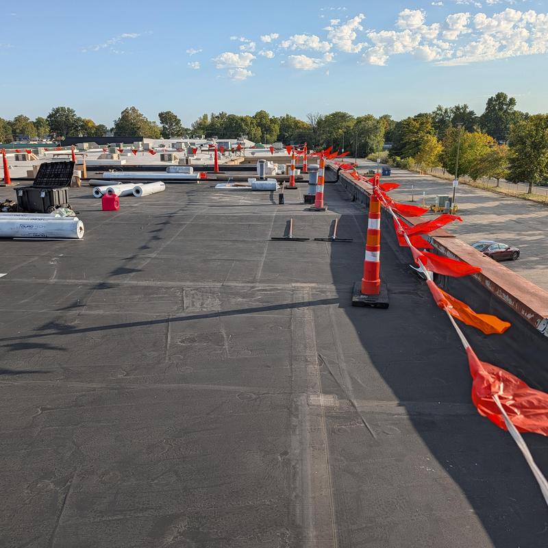 Rubber roofing membrane with safety cones and rolls