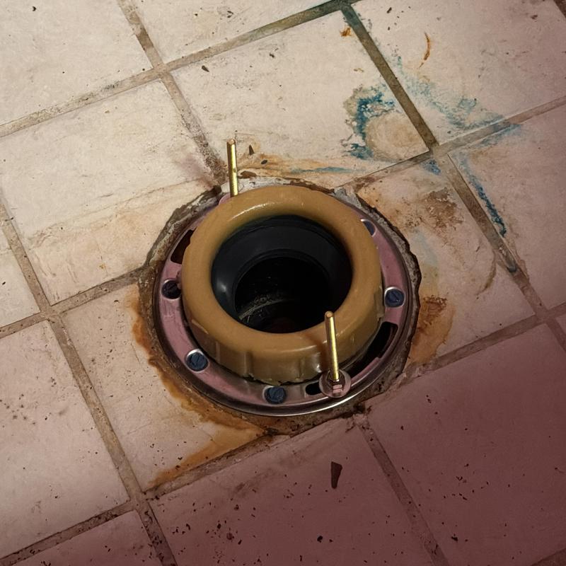 Toilet flange installation on tiled floor Toilet flange installation on tiled floor