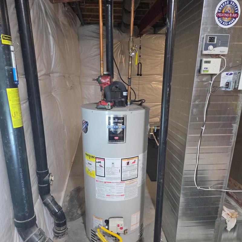 Power vent water heater installation in basement